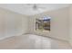 Bright bedroom featuring neutral walls and floors, and two closets at 3107 Troy Dr, Orlando, FL 32806
