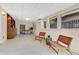 This bonus room provides lots of windows and natural light with two chairs at 3107 Troy Dr, Orlando, FL 32806