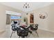 Open dining area with view of living room and kitchen, modern chandelier, and comfortable seating at 3107 Troy Dr, Orlando, FL 32806