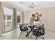 Bright dining room with sliding doors to the patio, modern furniture, and stylish decor at 3107 Troy Dr, Orlando, FL 32806