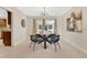 Cozy dining area featuring a modern chandelier and glass-top table, perfect for intimate meals at 3107 Troy Dr, Orlando, FL 32806