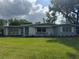 Attractive single-story home with a green lawn and charming brick accents at 3107 Troy Dr, Orlando, FL 32806