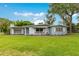 Charming single-story home with a well-manicured lawn and inviting curb appeal at 3107 Troy Dr, Orlando, FL 32806