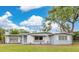 Charming single-story house with a manicured lawn and beautiful landscaping at 3107 Troy Dr, Orlando, FL 32806