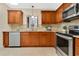 Traditional kitchen with wood cabinets, stainless steel appliances, and granite countertops at 3107 Troy Dr, Orlando, FL 32806