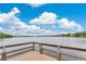 Breathtaking view of the lake, showcasing the expansive body of water and clear blue sky with scattered clouds at 3107 Troy Dr, Orlando, FL 32806
