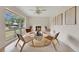 Charming living room with a cozy fireplace, comfortable seating, and bright natural light at 3107 Troy Dr, Orlando, FL 32806