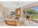 Inviting living room with large windows, comfortable seating, and view of a lush green lawn at 3107 Troy Dr, Orlando, FL 32806