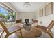 Bright living room with cozy seating around a modern fireplace and view of the neighborhood at 3107 Troy Dr, Orlando, FL 32806