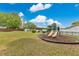 Community playground with slides and seating offers fun for all ages at 3107 Troy Dr, Orlando, FL 32806