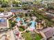 Stunning aerial view of a community pool area with lush landscaping and resort-style amenities at 3132 Calabria Ave, Davenport, FL 33897