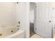 Clean bathroom features a large tub with shower and updated fixtures at 3132 Calabria Ave, Davenport, FL 33897