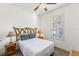 Cozy bedroom with bamboo accents, neutral colors, and natural light from the window at 3132 Calabria Ave, Davenport, FL 33897