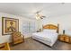 Inviting bedroom with a queen-size bed, tropical decor, and a bright window at 3132 Calabria Ave, Davenport, FL 33897