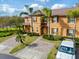 Charming two-story home with lush front yard landscaping and decorative window shutters at 3132 Calabria Ave, Davenport, FL 33897
