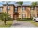 Charming two-story townhome with lush landscaping and paved driveway at 3132 Calabria Ave, Davenport, FL 33897