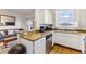 Bright kitchen features granite countertops and modern stainless steel appliances at 3132 Calabria Ave, Davenport, FL 33897