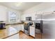 Bright kitchen features stainless steel appliances, white cabinets, and granite countertops at 3132 Calabria Ave, Davenport, FL 33897