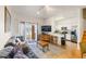 Open living area with sliding glass doors and adjacent kitchen with breakfast bar at 3132 Calabria Ave, Davenport, FL 33897