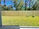 Private backyard with well-maintained lawn and tall fence providing security and a sense of seclusion at 3437 Possehl Pl, The Villages, FL 32163