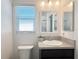 The bathroom includes a vanity and mirror, and a window at 3437 Possehl Pl, The Villages, FL 32163