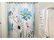 Bright bathroom featuring a decorative shower curtain and coordinating towels on a chrome towel bar at 3437 Possehl Pl, The Villages, FL 32163