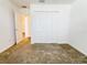 Bedroom features include carpet flooring and a closet with bi-fold doors at 3437 Possehl Pl, The Villages, FL 32163