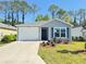 Charming single-story home with a well-manicured lawn and attached one-car garage at 3437 Possehl Pl, The Villages, FL 32163