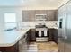 Kitchen featuring stainless steel appliances and ample countertop space at 3437 Possehl Pl, The Villages, FL 32163