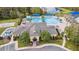 Aerial view of community clubhouse, pool, and recreation area with beautiful landscaping at 3616 Deer Oak Cir, Oviedo, FL 32766