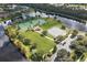 Aerial view of the tennis and basketball courts located on the community pond at 3616 Deer Oak Cir, Oviedo, FL 32766