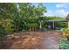 Spacious backyard featuring a patio, lush landscaping, and outdoor seating areas, ideal for entertaining and relaxation at 3616 Deer Oak Cir, Oviedo, FL 32766