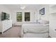 Bright bedroom with two twin beds, a dresser, and built-in shelving, providing a comfortable and organized space at 3616 Deer Oak Cir, Oviedo, FL 32766