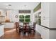 Inviting dining area with windows providing ample natural light and garden view at 3616 Deer Oak Cir, Oviedo, FL 32766