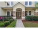 Stylish front door with stone accents and manicured landscaping at 3616 Deer Oak Cir, Oviedo, FL 32766