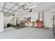 Spacious garage with painted floor, overhead lighting, and ample space for storage at 3616 Deer Oak Cir, Oviedo, FL 32766