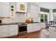 Bright kitchen with white cabinetry, stainless steel appliances, and a view to the dining area at 3616 Deer Oak Cir, Oviedo, FL 32766