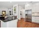 Modern kitchen with stainless steel refrigerator and black countertops at 3616 Deer Oak Cir, Oviedo, FL 32766