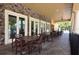 View of the community's shaded patio with decorative stone wall and cozy seating at 3616 Deer Oak Cir, Oviedo, FL 32766