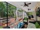 Enclosed patio with comfortable seating, ceiling fans, and views of the landscaped backyard, creating an inviting outdoor space at 3616 Deer Oak Cir, Oviedo, FL 32766