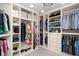 Spacious walk-in closet with custom shelving, hanging rods, and ample storage space for clothes, shoes, and accessories at 3616 Deer Oak Cir, Oviedo, FL 32766