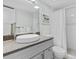 Modern bathroom with granite countertops, vessel sink, and a tiled shower at 3801 S Atlantic Ave # 114, New Smyrna Beach, FL 32169