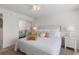 Cozy bedroom featuring soft lighting, a comfortable bed, and sliding closet doors at 3801 S Atlantic Ave # 114, New Smyrna Beach, FL 32169