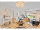 Bright dining area with seating, opening up to the outdoor patio at 3801 S Atlantic Ave # 114, New Smyrna Beach, FL 32169