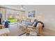 Inviting living room featuring modern decor, ample seating, and a sliding glass door at 3801 S Atlantic Ave # 114, New Smyrna Beach, FL 32169