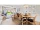 Cozy living room and dining area featuring stylish furnishings and natural light at 3801 S Atlantic Ave # 114, New Smyrna Beach, FL 32169