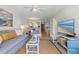 Spacious living room featuring stylish furnishings, modern decor, and an open-concept design at 3801 S Atlantic Ave # 114, New Smyrna Beach, FL 32169