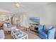 Comfortable living room featuring stylish furnishings and an open concept kitchen and dining area at 3801 S Atlantic Ave # 114, New Smyrna Beach, FL 32169