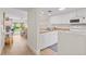 Open-concept kitchen and living room with stylish decor and natural light at 3801 S Atlantic Ave # 114, New Smyrna Beach, FL 32169