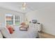 Serene main bedroom with a full bed, dresser, and natural light at 3801 S Atlantic Ave # 114, New Smyrna Beach, FL 32169